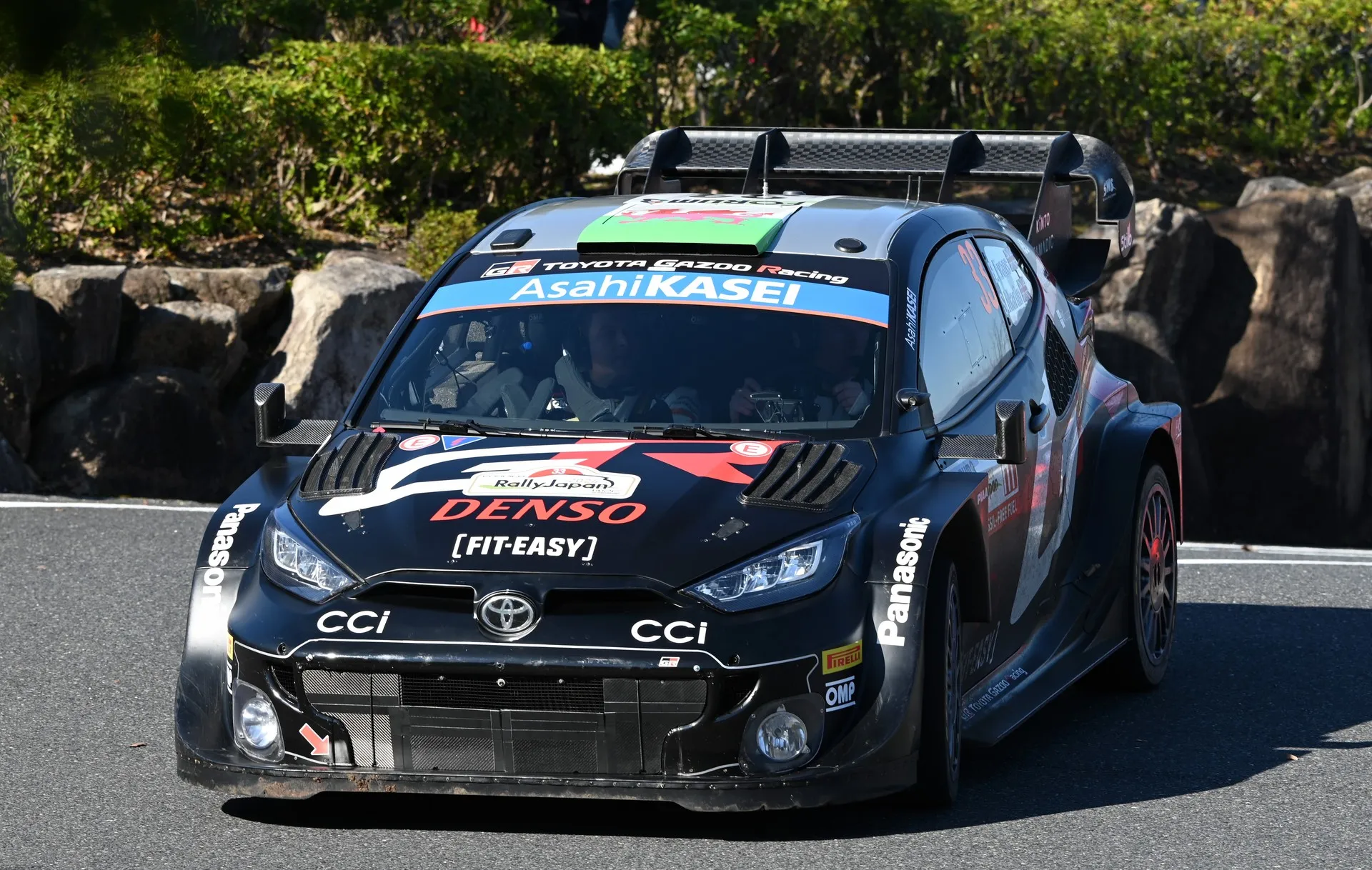 Elfyn Evans' Toyota GR Yaris Rally1 car competing on a rally stage