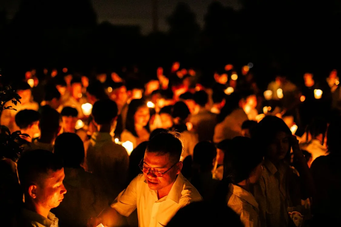 Candles lit at a community vigil, honouring lives lost