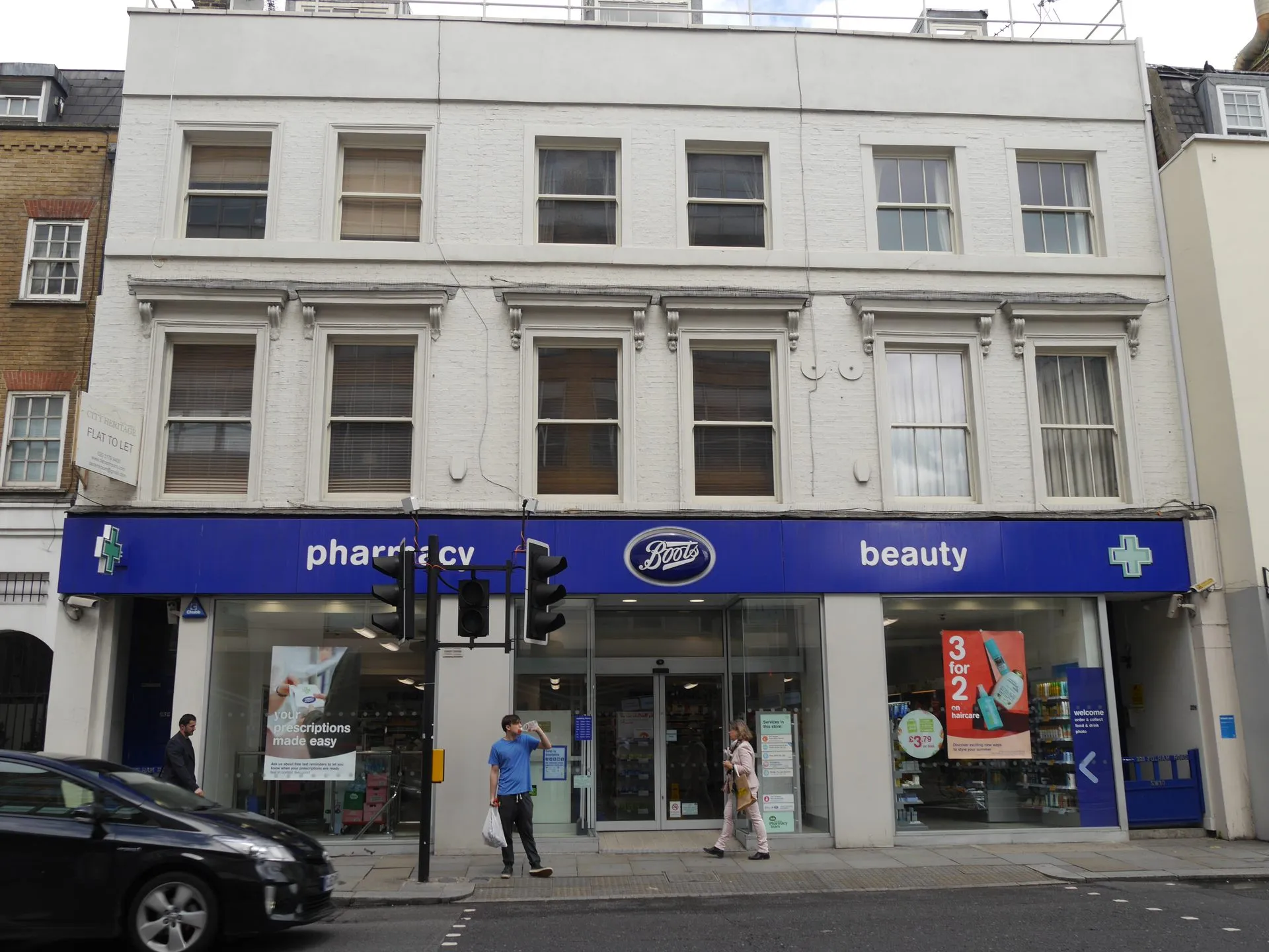 A Boots pharmacy storefront on Fulham Road in Chelsea, London.