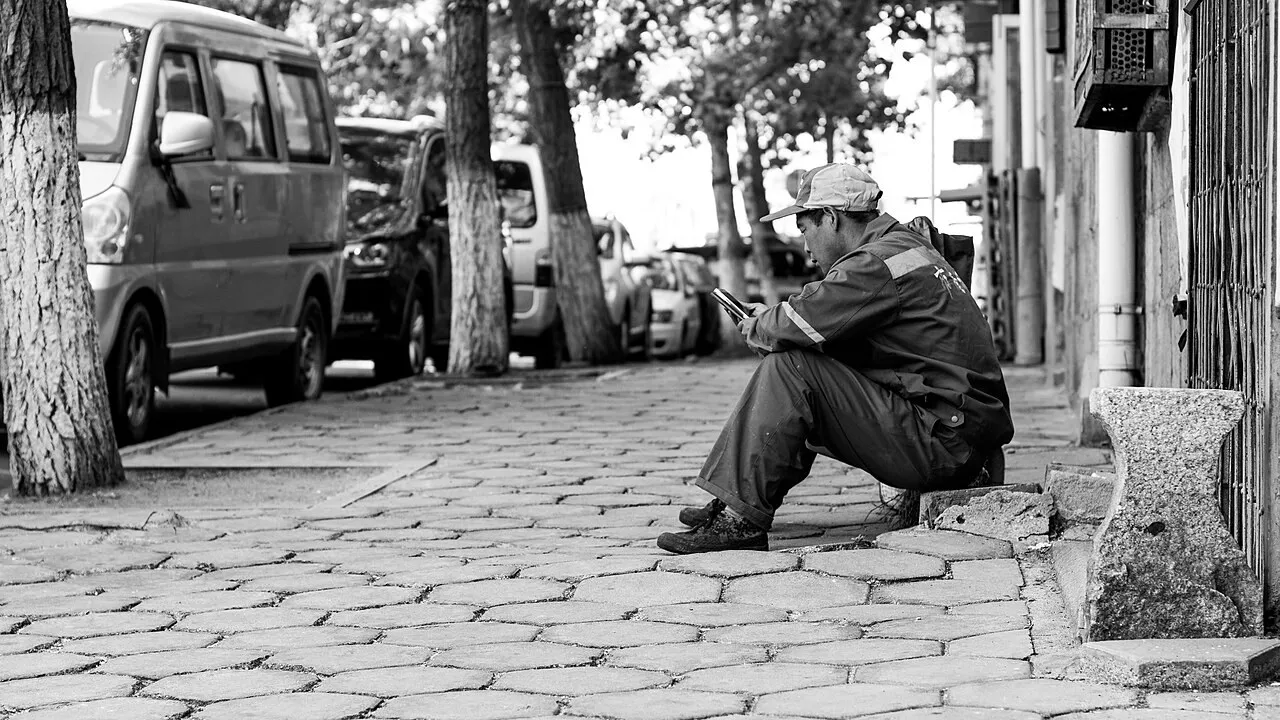 A person taking a break and using a smartphone to chat with friends